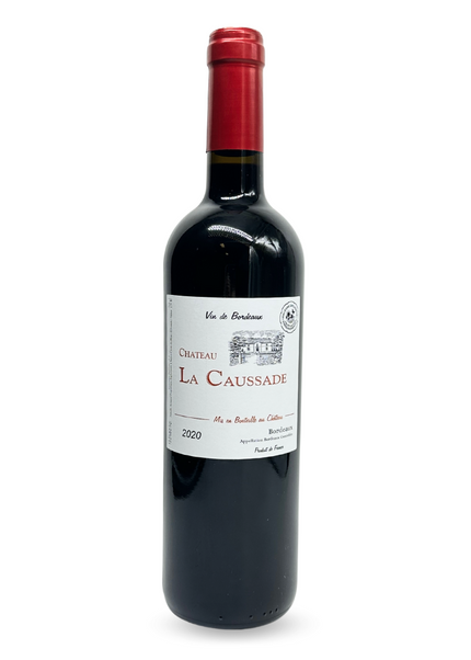A bottle of Chateau La Caussade Bordeaux Rouge 2021 wine with a red cap and a label that includes the name of the vintage and the château.